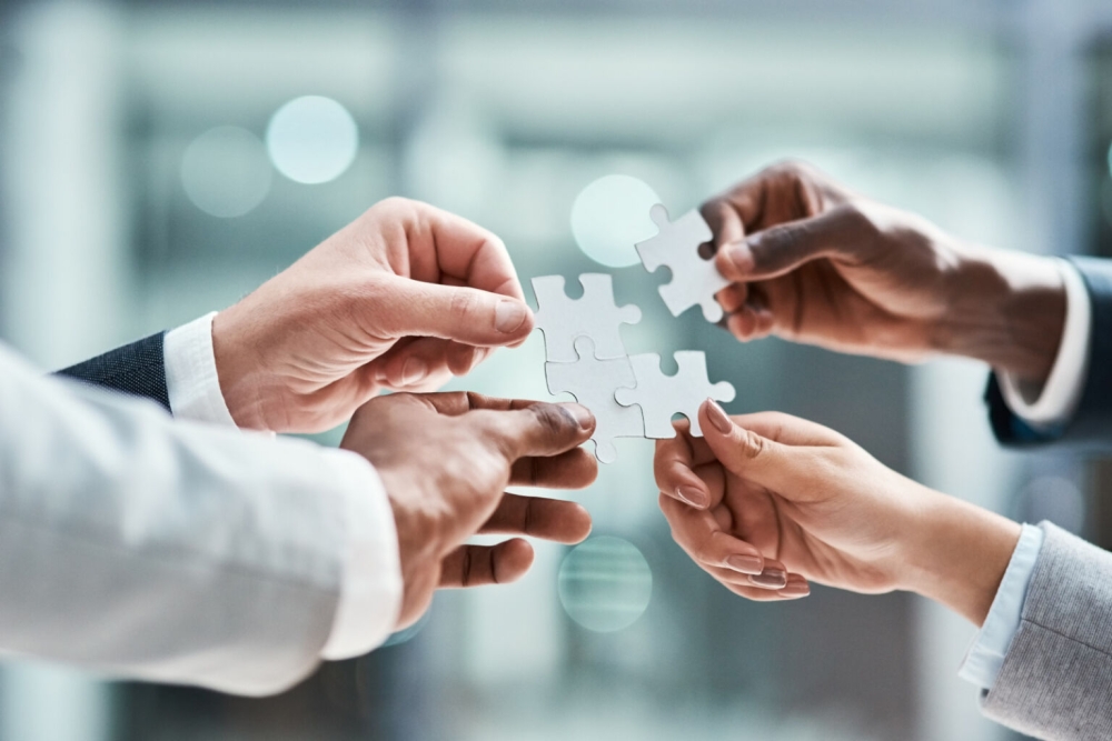 Hands with a puzzle piece