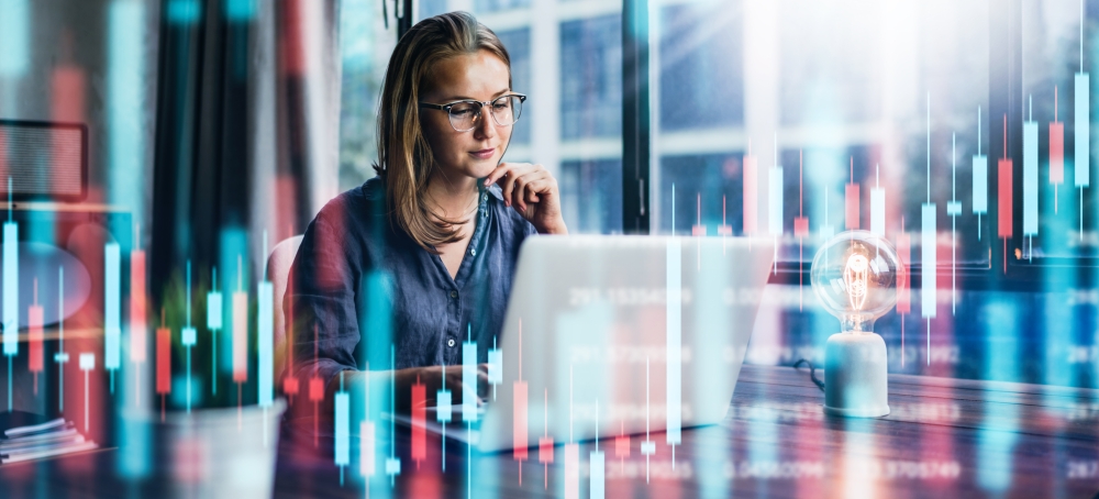 Lady looking at a laptop screen in a virtual data setting